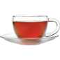 Clear glass teacup with a red liquid on a white background